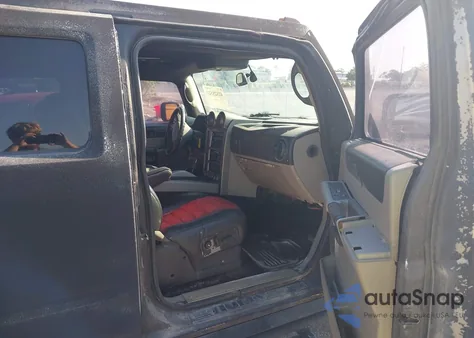 2003 Hummer H2 z USA, uszkodzony, nr VIN 5GRGN23UX3H140510